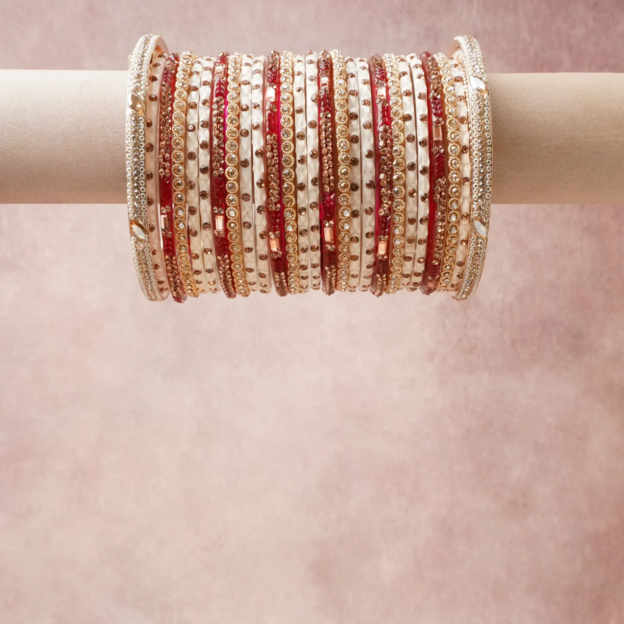 A grounding Cream forms the heart of the set, while touches of Gold, Crimson Red, Clear add charm.

A thoughtful composition of Gold-toned Metal, Enamel, Glass Crystals, designed to feel complete without being heavy.
Each element layers seamlessly, creating a look that is refined, wearable and quietly striking.